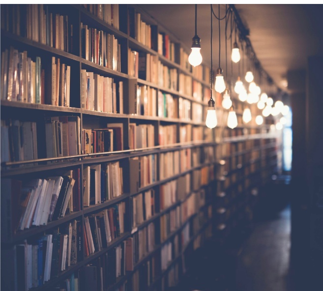 Warm library shelves with hanging lights