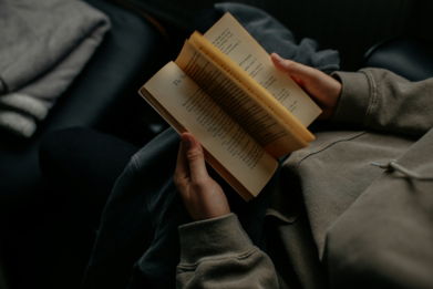 person-reading-book-white-sitting.jpg person reading book white sitting