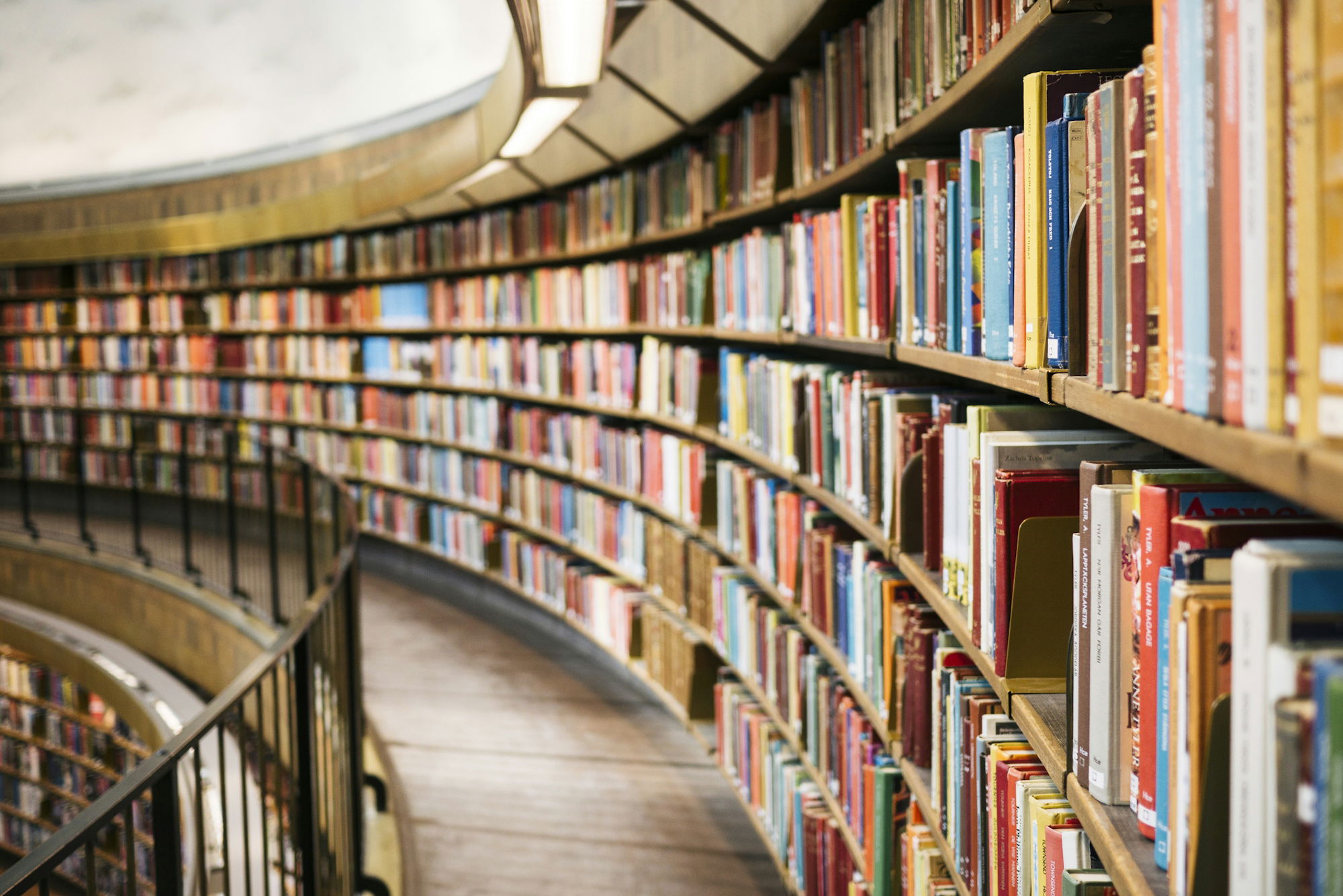 books-on-brown-wooden-shelf.jpg books on brown wooden shelf